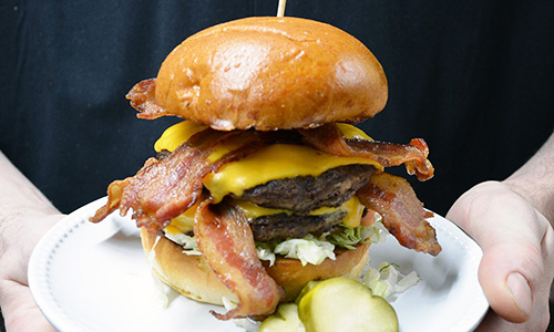 Chef holding burger